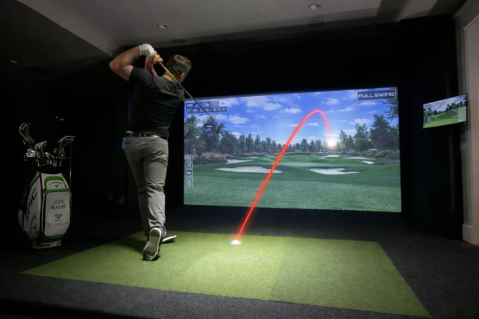 Full Swing's real ball flight — the simulator screen continues the actual shot from the point of impact